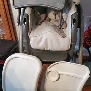 Convertible high chair includes buster seat.